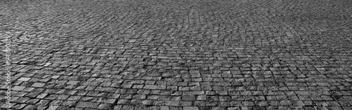 Old square cobble stone. paving perspective background. Paved stone pavement texture Cobblestone pavement Square sidewalk. texture. Cobbled stone street road pattern. Square in prospect. rock stoned  