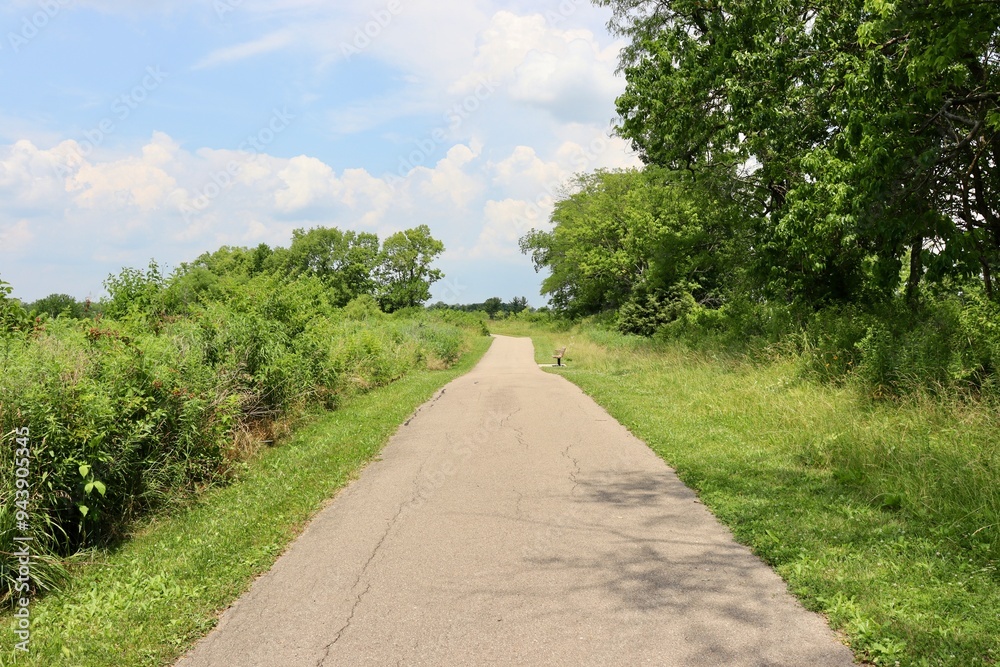 The long pathway in the countryside on a sunny day. The long pathway in the countryside on a sunny day.