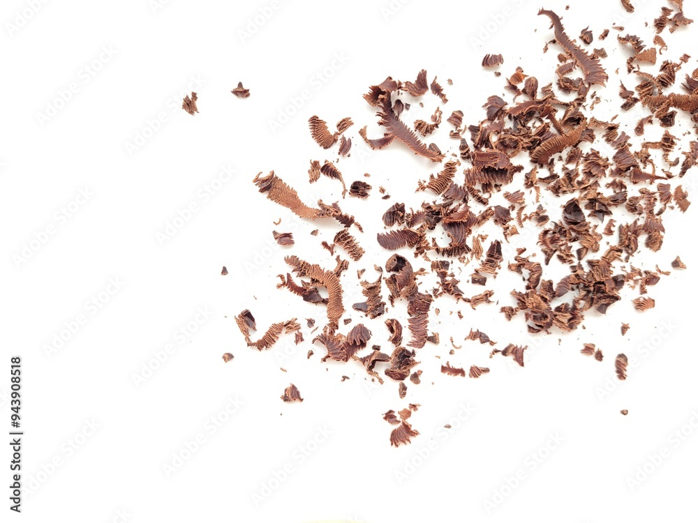 Grated chocolate pieces on a white background. Grated chocolate pieces on a white background.