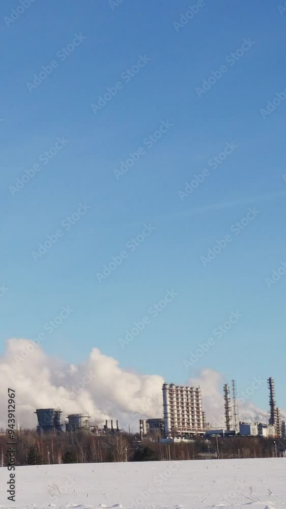 Clouds moving over industrial complex in winter Clouds moving over industrial complex in winter