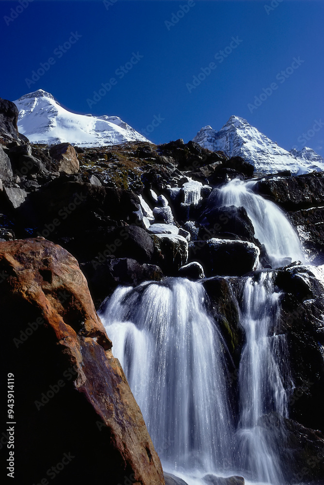 Obraz premium Series of waterfalls cascading over rugged mountainside near Lake Oesa in Yoho National Park, BC, Canada; British Columbia, Canada