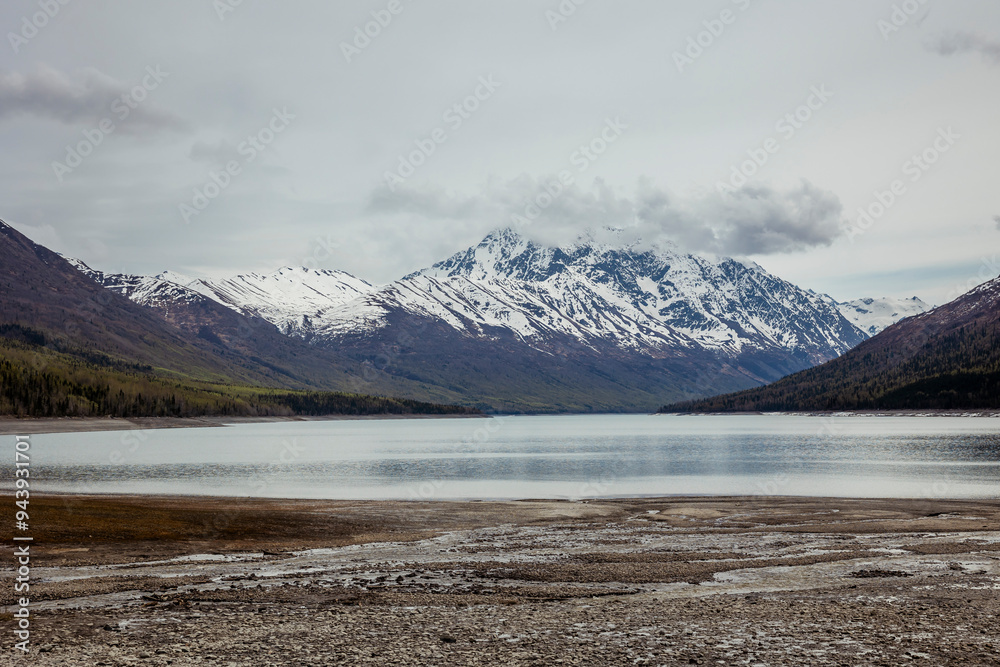 View of mountains and Eklutna Lake on a cloudy day in the Chugach State Park near Anchorage, Alaska; Anchorage, Alaska, United States of America View of mountains and Eklutna Lake on a cloudy day in the Chugach State Park near Anchorage, Alaska; Anchorage, Alaska, United States of America