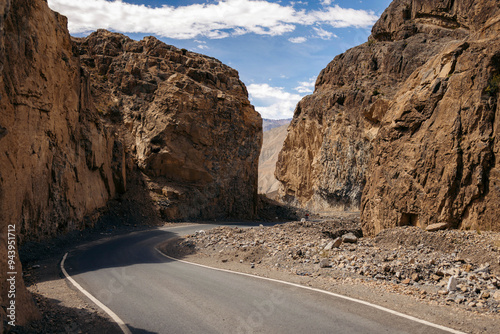 Rugged cliffs along a paved road in the Western Himalayas, Spiti Valley, Hikam area, Himachal Pradesh, India; Himachal Pradesh, India photo