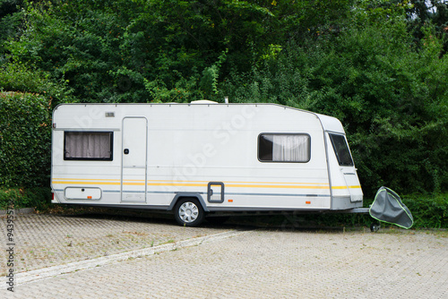 Caravan trailer is parked in the parking lot
