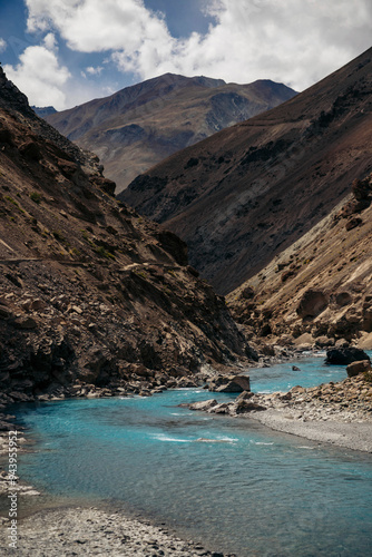 Aquamarine coloured river flowing through a Himalayan valley on route to Phuktal Gompa (Monastary) near Purne, Zanskar, Ladakh; Zanskar, Ladakh, India photo