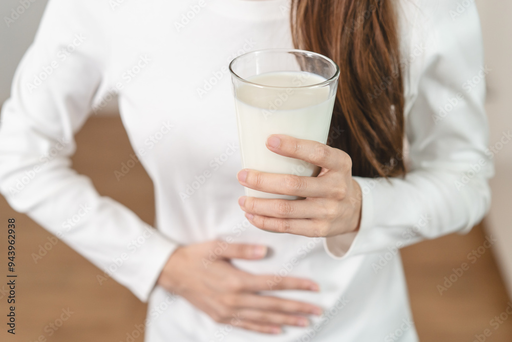 lactose intolerance concept. Woman having a stomach ache from lactose intolerance. lactose intolerance concept. Woman having a stomach ache from lactose intolerance.