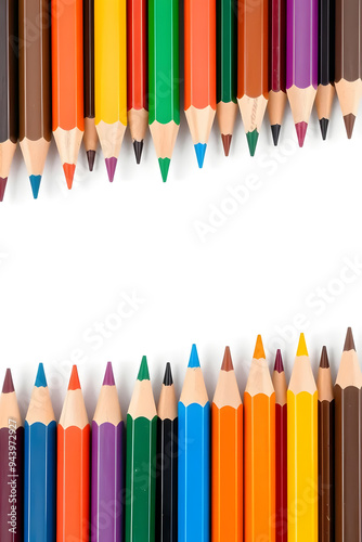 A vibrant collection of colored pencils arranged in a row, showcasing a variety of colors including red, blue, green, yellow, and orange against a white background.