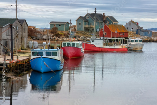 Harbour at Peggy's Cove on a moody and cloudy day. Colourful boats and houses are here; Peggy's Cove, Nova Scotia, Canada