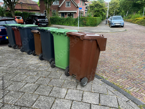 Many color trash bins on city street