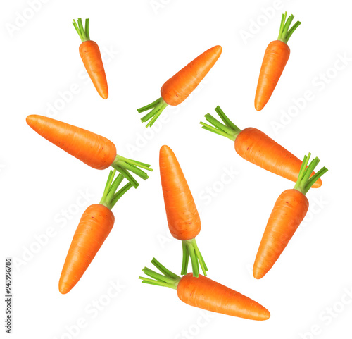 Whole ripe carrots in air on white background