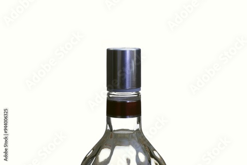 Transparent bottle with liquid with a screw cap.