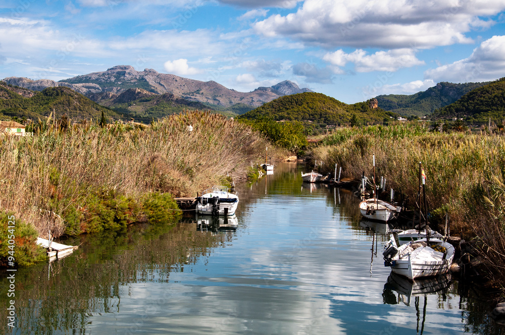An inland view from the pretty Majorcan town of Port d'Andratx, with boats and the sky reflected in the water An inland view from the pretty Majorcan town of Port d'Andratx, with boats and the sky reflected in the water
