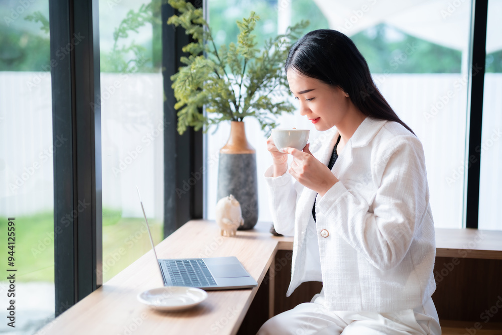 Portrait of beautiful happy Smiling of hands Holding cup mug of Hot coffee latte wits business female casual working with laptop computer in coffee shop like the background,communication concept Portrait of beautiful happy Smiling of hands Holding cup mug of Hot coffee latte wits business female casual working with laptop computer in coffee shop like the background,communication concept