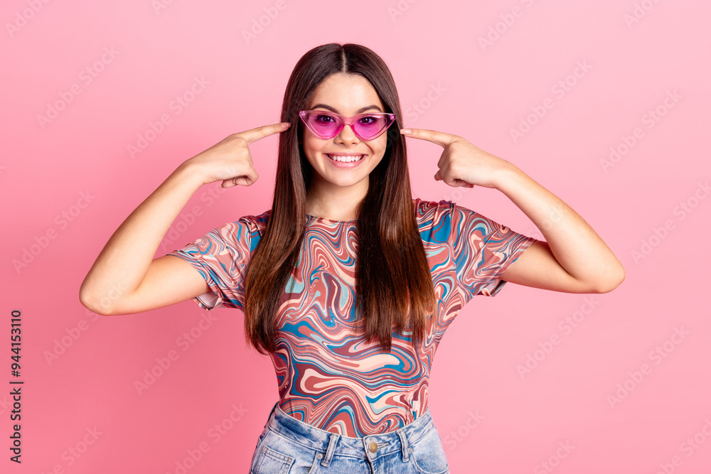 Photo of charming sweet girl wear print t-shirt showing fingers dark glasses isolated pink color background Photo of charming sweet girl wear print t-shirt showing fingers dark glasses isolated pink color background