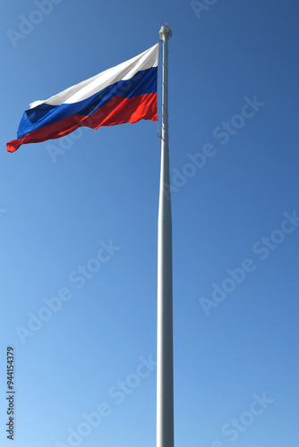 Flag of Russian Federation on background of blue sky