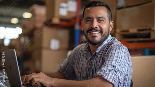 Middle aged young hispanic warehouse distribution logistic deliery centre manager or employee preofessional smiling at camera with toothy smile surrounded with shelves with cardboard boxes