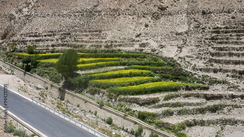 terraces beside road in a deserted valley in eastern tibet