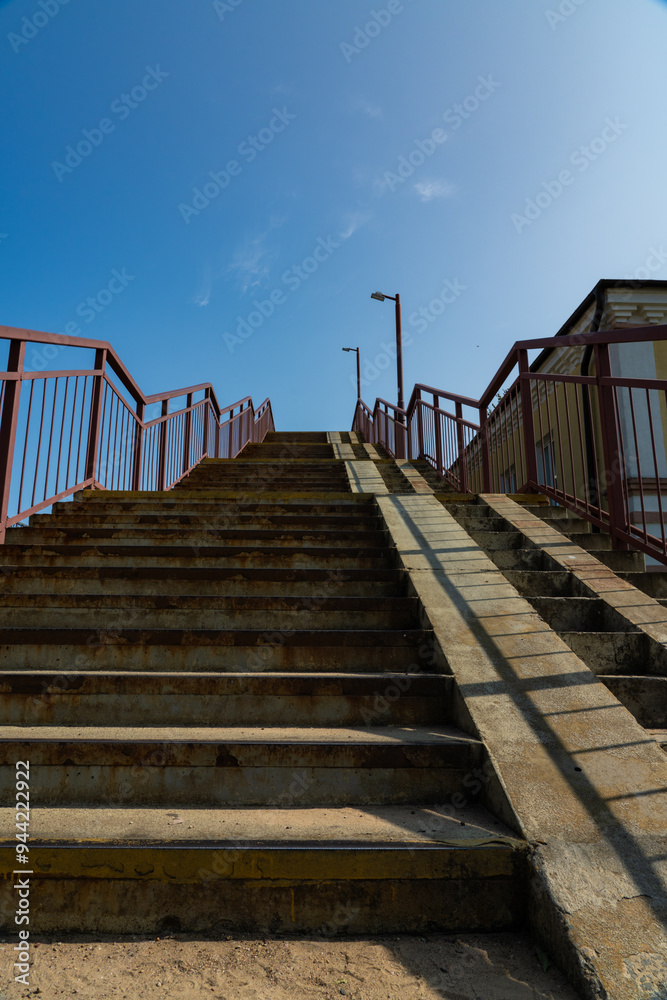 Steps up, pedestrian crossing over railway tracks Steps up, pedestrian crossing over railway tracks