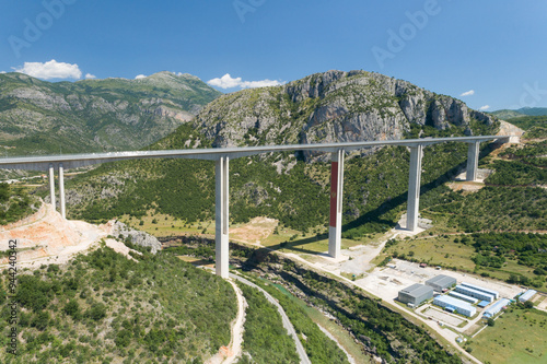 Aerial view of new concrete bridge over the Moraca river canyon in Montenegro photo