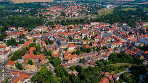 A wide angle aerial view of the old town of the city Weissenfels on a summer noon in Germany. photo