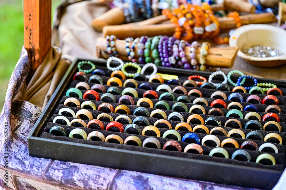 various colored ceramic rings, handmade in the display of a jewelry vendor at the Viking festival, or medieval market, Schonungen, Schweinfurt, Germany various colored ceramic rings, handmade in the display of a jewelry vendor at the Viking festival, or medieval market, Schonungen, Schweinfurt, Germany