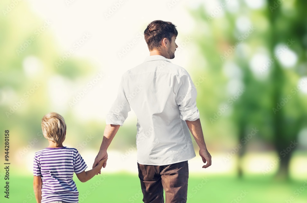 Happy father with small son on field at summer Happy father with small son on field at summer