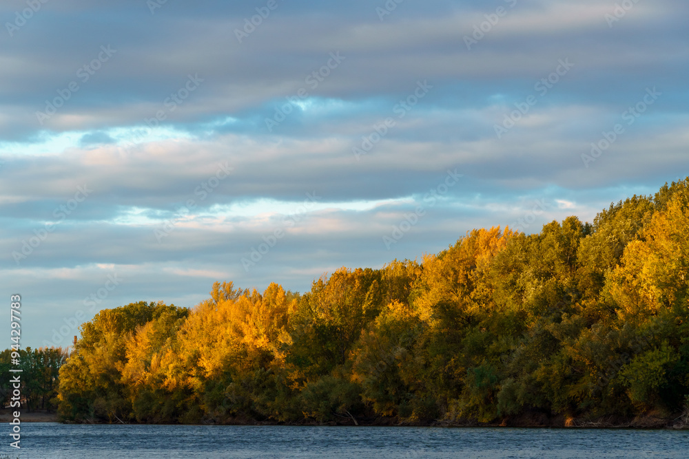 beautiful autumn landscape with river and forest, cloudy sky beautiful autumn landscape with river and forest, cloudy sky