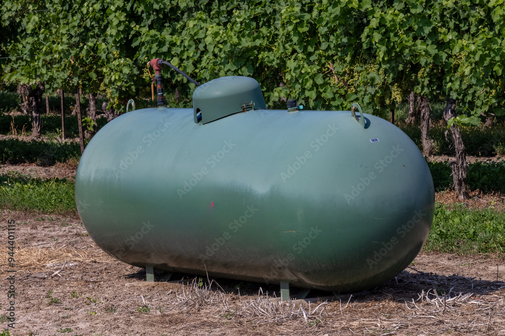 A propane or LPG tank in a farmer's field for frost control A propane or LPG tank in a farmer's field for frost control