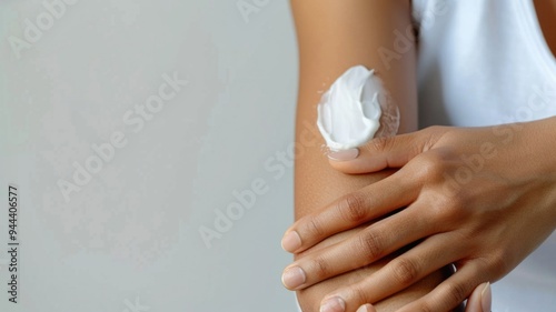 Wallpaper Mural A person with sensitive skin gently applying a hypoallergenic lotion to their arm, with a soothing expression Torontodigital.ca