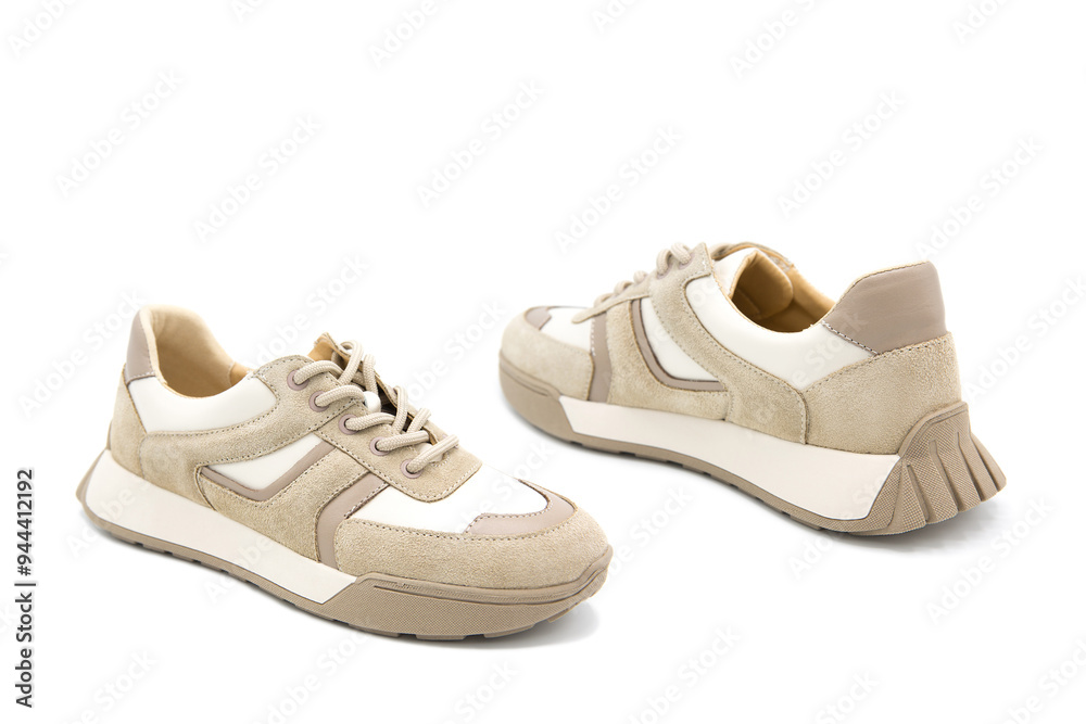Sneakers. Pair of fashionable leather with suede inserts shoes isolated on white background. Sneakers. Pair of fashionable leather with suede inserts shoes isolated on white background.