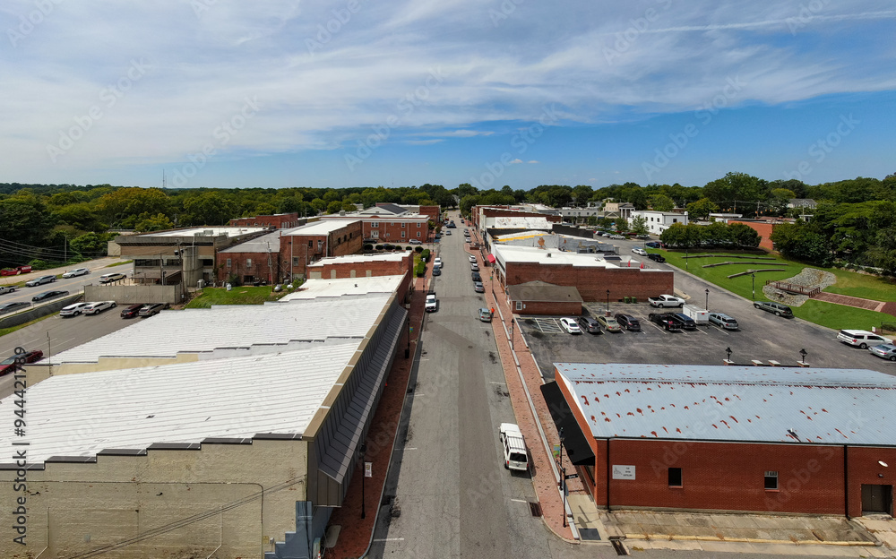 Daytime Drone Images of Downtown Louisburg North Carolina on a Sunny Day, Featuring the Historic Downtown Area, The Franklin County Courthouse, and The Tar River. Daytime Drone Images of Downtown Louisburg North Carolina on a Sunny Day, Featuring the Historic Downtown Area, The Franklin County Courthouse, and The Tar River.