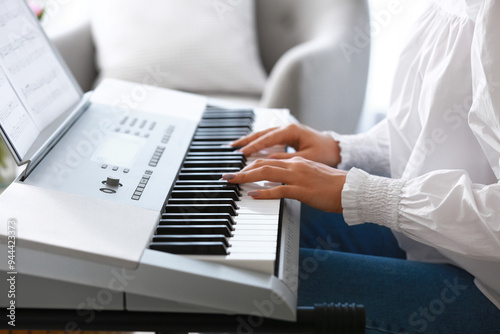 Young female musician playi...