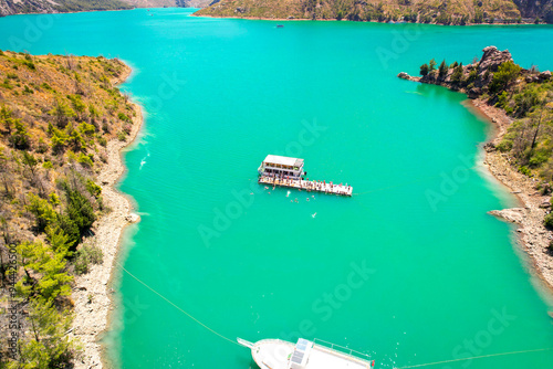 Mediterranean coastline in Turkey, with yachts on very clear blue water photo