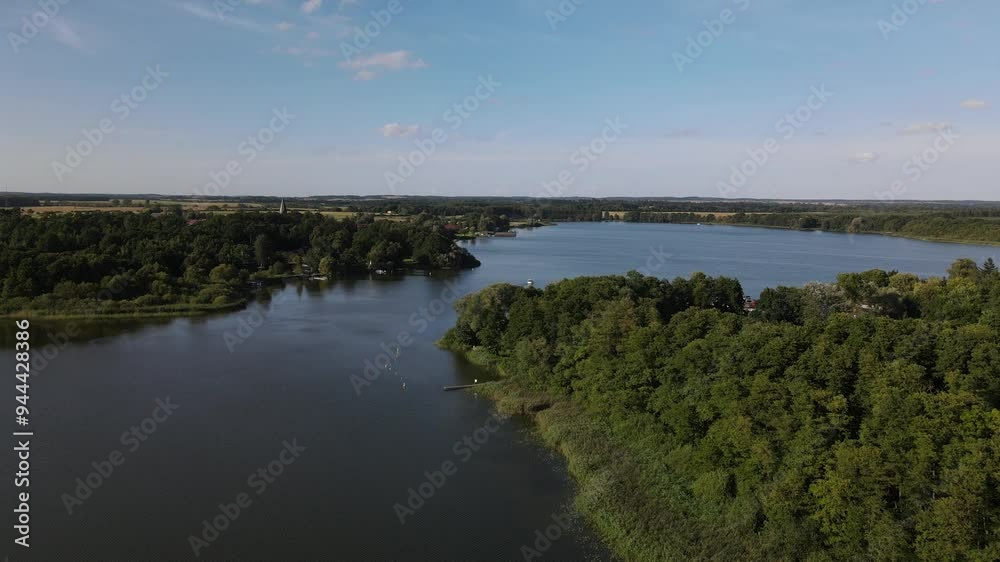 Fly over the a green and scenic nature area called Jabelscher See which is located at the Mecklenburg Vorpommern Lake area as the known former East Germany region Fly over the a green and scenic nature area called Jabelscher See which is located at the Mecklenburg Vorpommern Lake area as the known former East Germany region