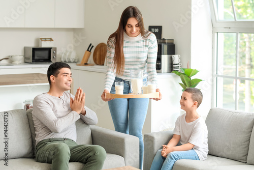 Young woman bringing tray w...