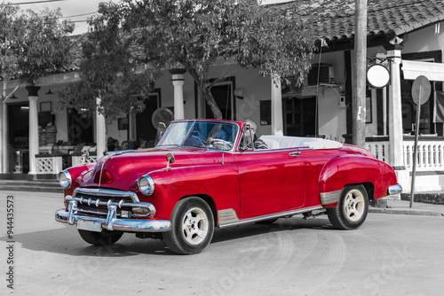 classic red convertible car in the streets of havanna cuba