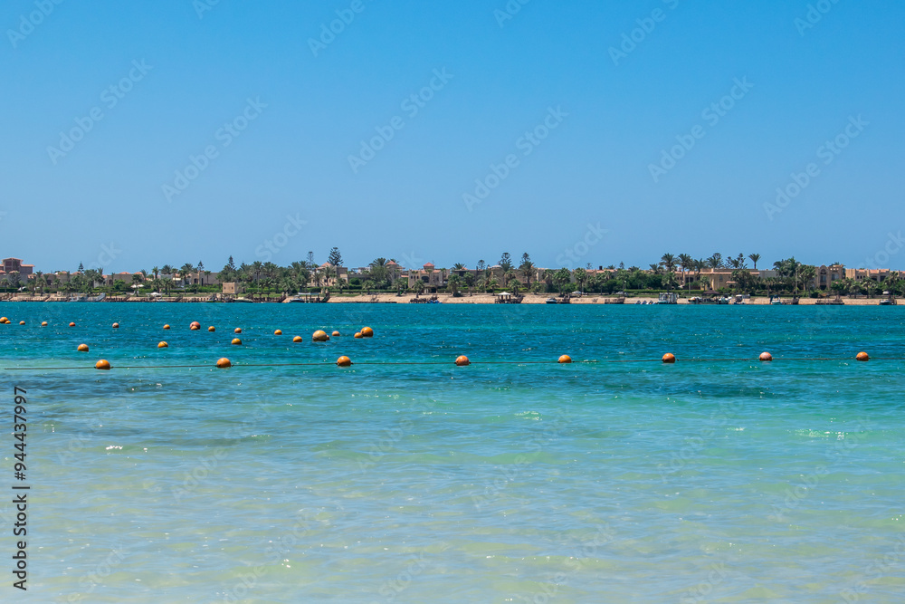 Obraz premium beach with palm trees blue sea and sky
