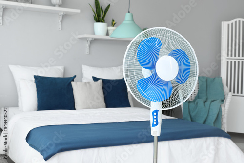 Floor fan and cozy bed in i...