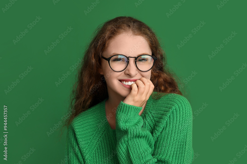 Portrait of shy young woman on green background Portrait of shy young woman on green background