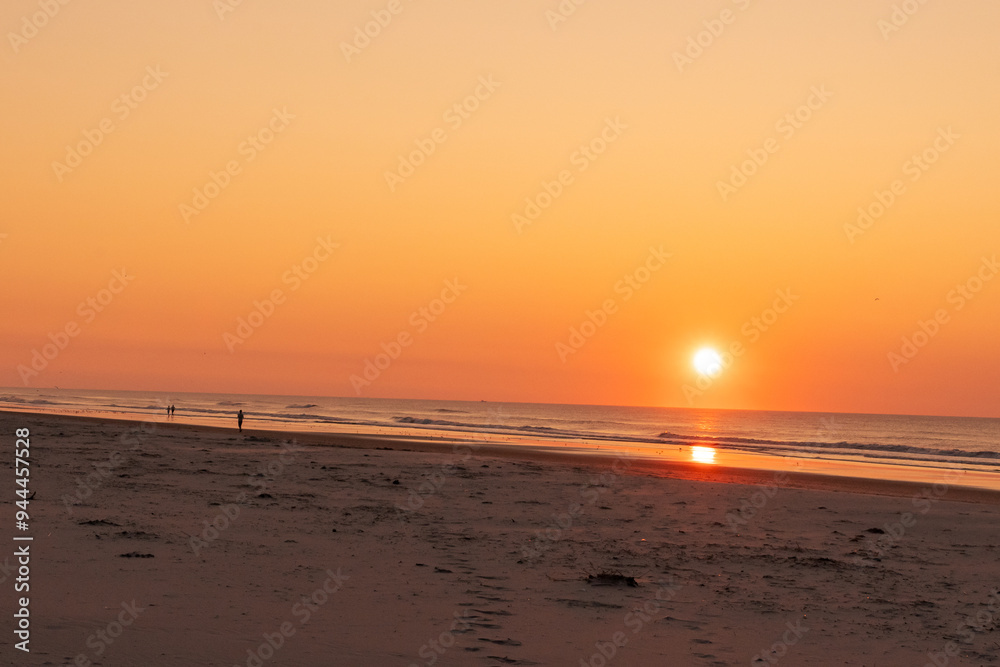 Avalon, New Jersey, USA - Ocean waves at sunrise off the beach in Avalon New Jersey on the southern New Jersey shore south of Atlantic City Avalon, New Jersey, USA - Ocean waves at sunrise off the beach in Avalon New Jersey on the southern New Jersey shore south of Atlantic City