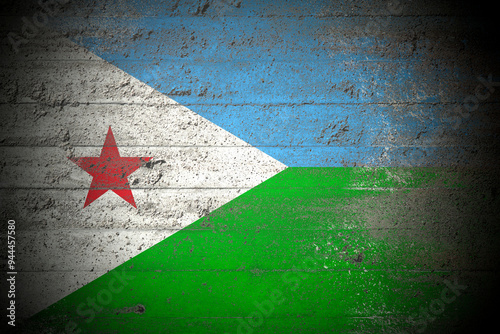 Flag of Djibouti on rough concrete wall photo