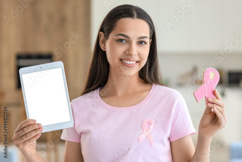Young woman with cookie and...