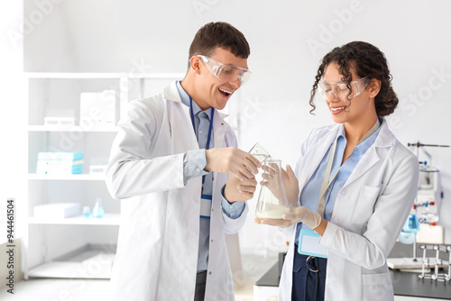 Young chemists doing reacti...
