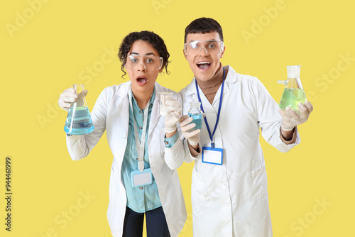 Shocked young chemists with...