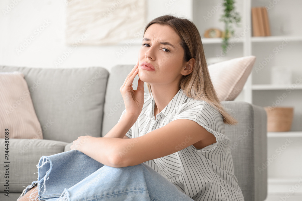 Young woman suffering from tooth ache at home Young woman suffering from tooth ache at home