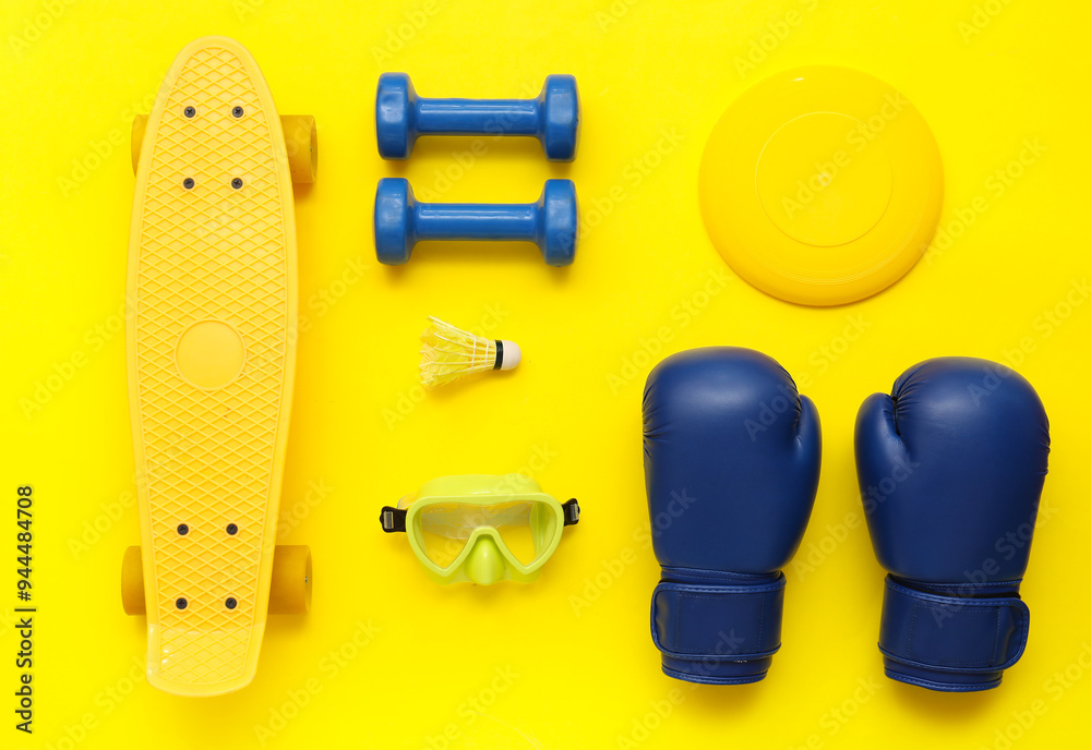 Fototapeta premium Set of sports equipment on yellow background