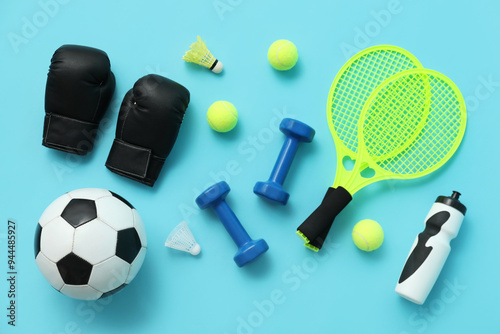 Fototapeta Naklejka Na Ścianę i Meble -  Set of sports equipment on blue background, top view