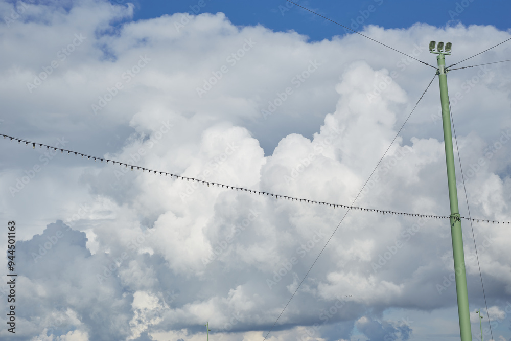 cloudy blue sky with light bulb garlands cloudy blue sky with light bulb garlands