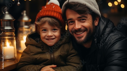 Happy father and son hugging and wearing Santa hat at Christmas decorated home