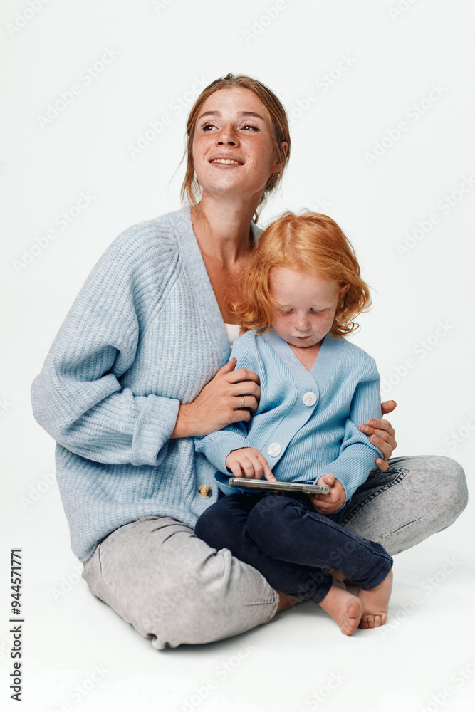 Family time mother and daughter using tablet computer together at home for entertainment and education Family time mother and daughter using tablet computer together at home for entertainment and education
